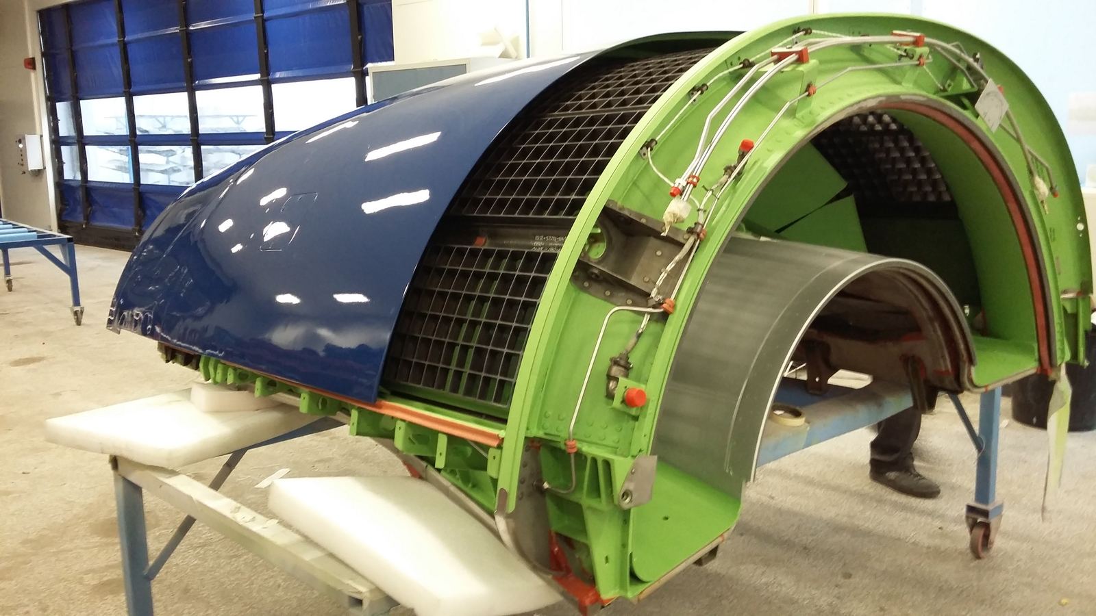 Fan cowl panels in the shop during a teardown